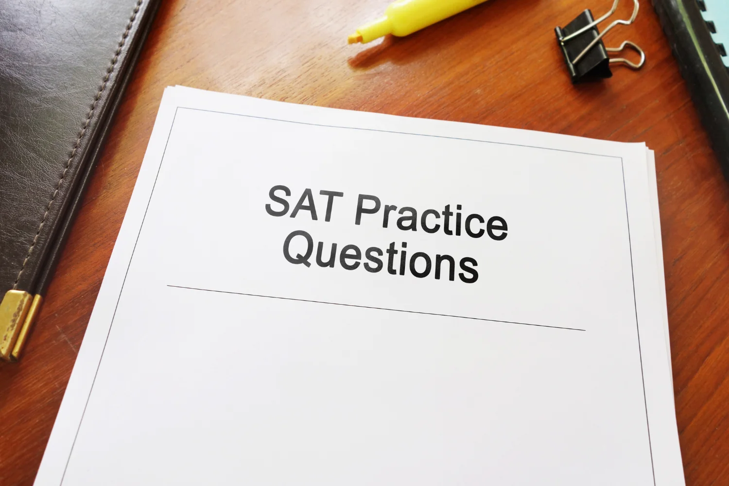 stack of paper topped by a page that says SAT Practice Questions